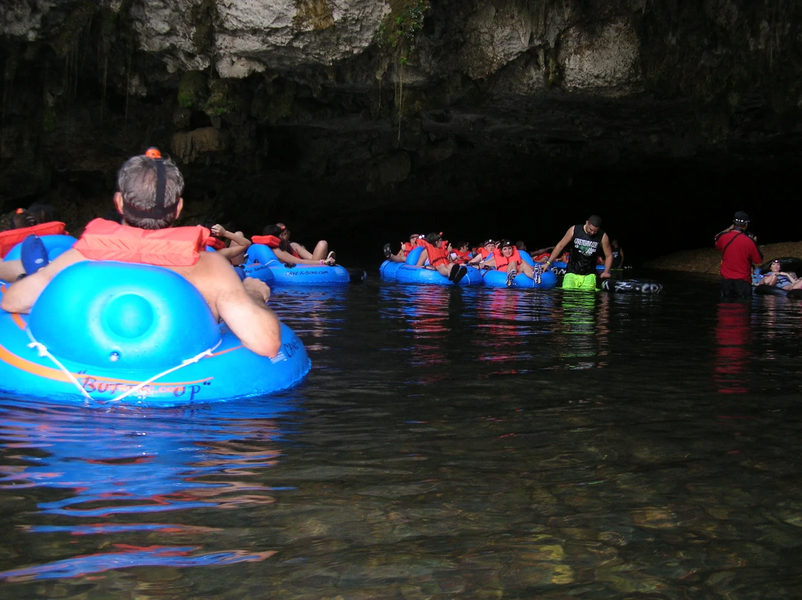 Cave tubing guests floating through Nohoch Che'en cave